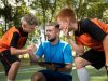 Football trainer teaching his pupils