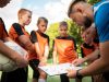 Football trainer teaching his pupils